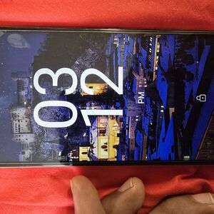 Black Smartphone with Scenic Wallpaper